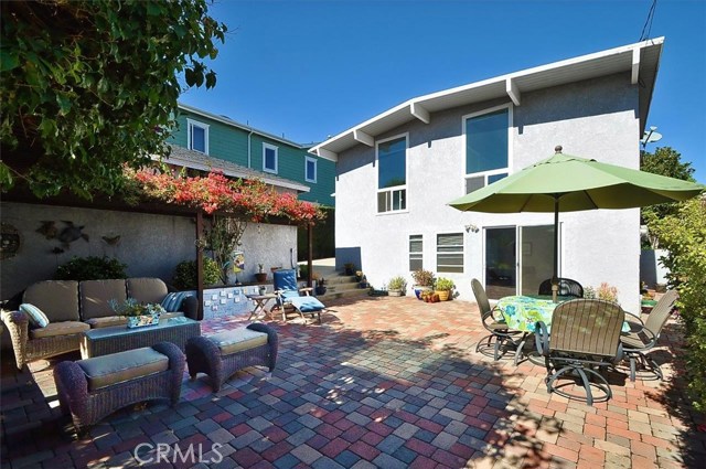 Looking into the back of the main house from a great backyard patio area