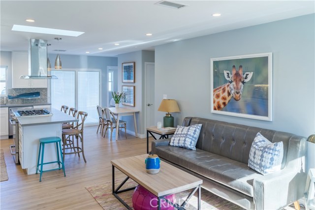 Wonderful open floor plan features hardwood floors, skylight, recessed lighting and dual pane windows.