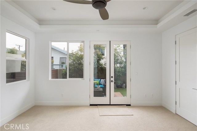 1ST LEVEL BEDROOM LEADING TO PRIVATE BACK YARD . . .