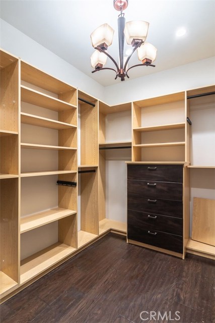 New lighting in walk-in master closet with built-ins