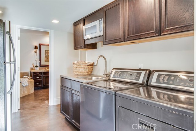 laundry and kitchenette area looking toward that full bath on lower level