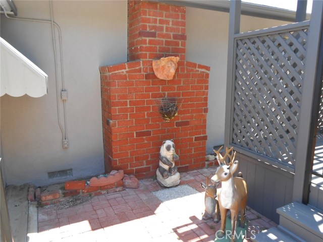 Exterior view of Red Brick Fireplace in Formal Living Room.