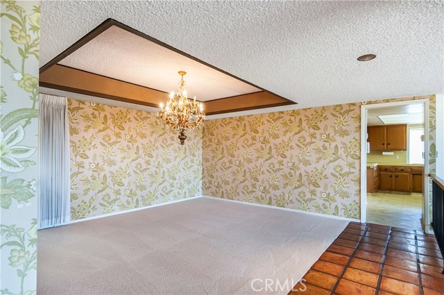 Large dining room adjacent to the kitchen.