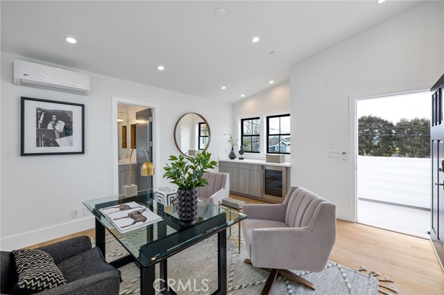 Private living quarters above garage shown here as a study/office