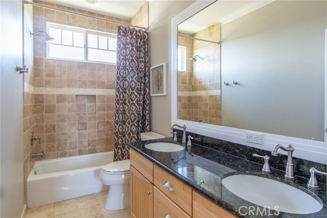 2nd floor full guest bathroom with shower + tub and double vanity with lots of room and storage