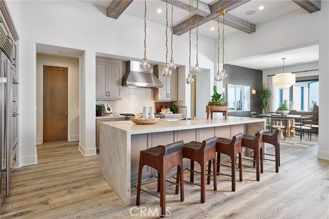 Kitchen and dining room, model home shown.