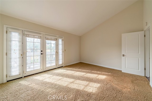 2nd bedroom has dramatic cathedral ceilings.