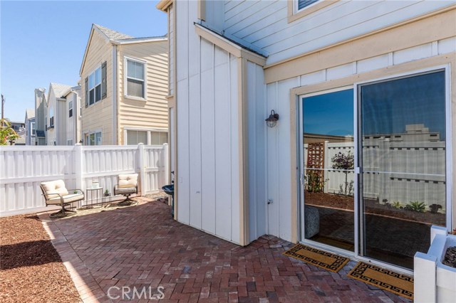Spacious back yard with brick patio and room for a hammock, a BBQ, maybe some Edison lights and a firepit? Go wild with a contemporary container garden.