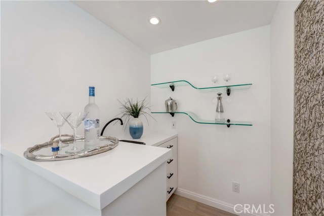 Wet bar with sink and built-in drawers.