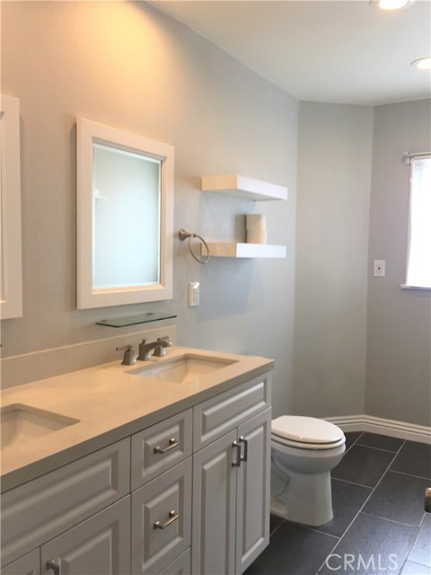 Solid counter tops with white cabinetry