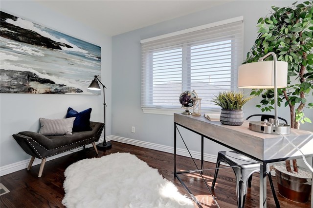 Custom window treatments and hardwood floors set this bonus room apart from the rest!