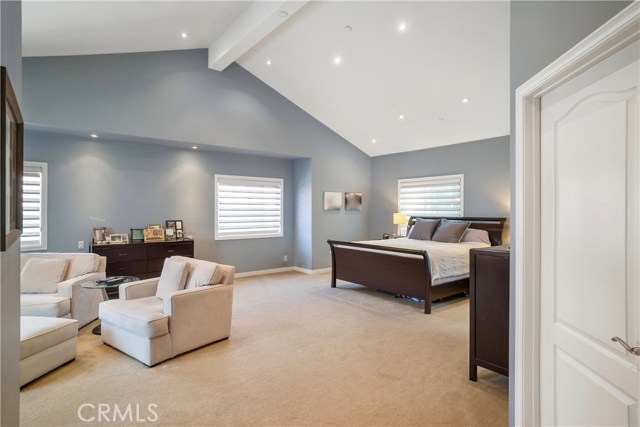 Spacious Master Suite w/large walk in closet, fireplace, and custom window covers.