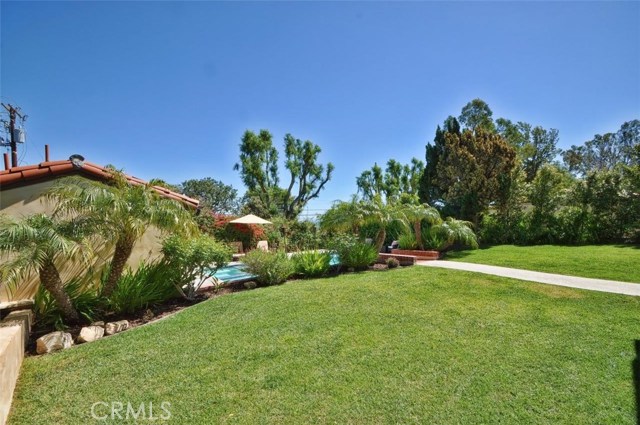 Who wouldn't like to run and play in this large backyard? The Pool has an Automatic Electric Cover so the backyard is safe for little ones.