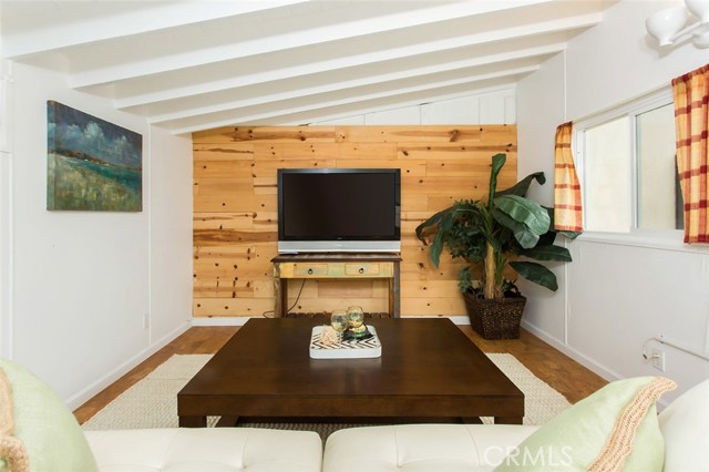 Detached bonus room with unique cork flooring and wood beam ceiling.