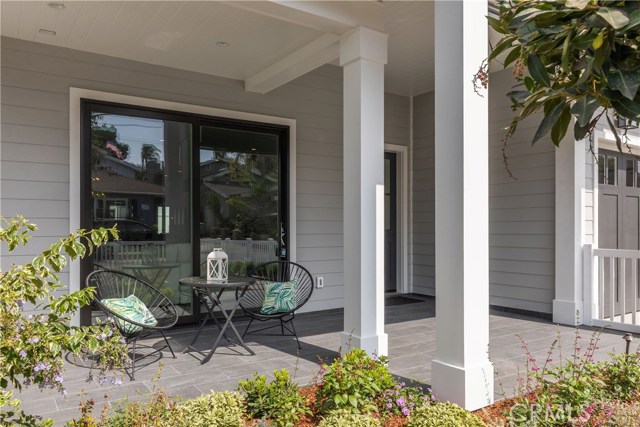 Charming front patio, perfect for a porch swing and morning coffee