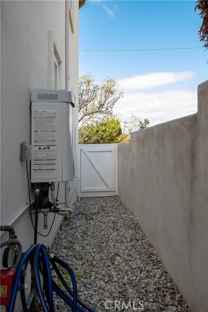 Ample side yard for a dog dun and a great place to tuck your garbage bins out of sight.