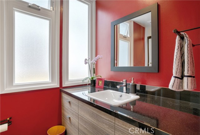 Recently renovated downstairs bath.  Granite counters, new vanity, new porcelain tile floor, new fixtures, etc.  Tub shower not pictured.