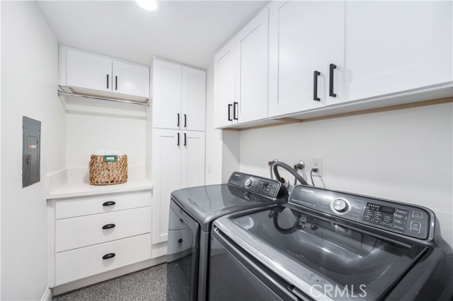 Laundry room with loads of storage