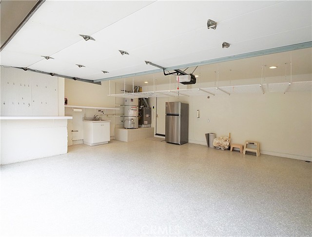 Garage with Laundry Hookups and Sink; Storage Cabinets Garage with Laundry Hookups and Sink; Storage Cabinets