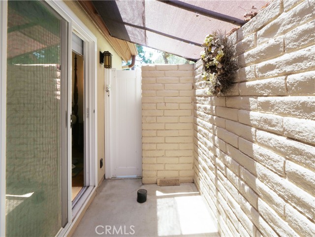 Master bedroom suite with its own private patio and a gate that leads to the front entry walkway.