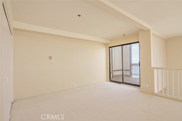 Loft Bedroom with Sliding Glass Doors to West Facing Ocean View Deck