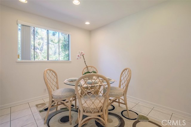 Open area off kitchen set up for dining, can also be used as a family room