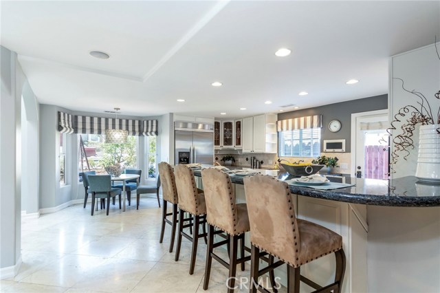 Multiple options for dining including a spacious counter and a dining nook.