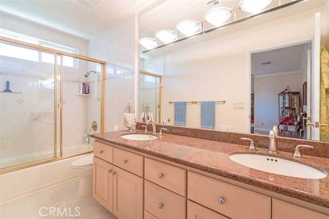Master Bathroom with large double vanity, shower/tub combo