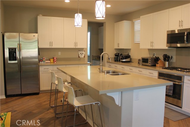 Corian counter top and cabinet handles throughout.