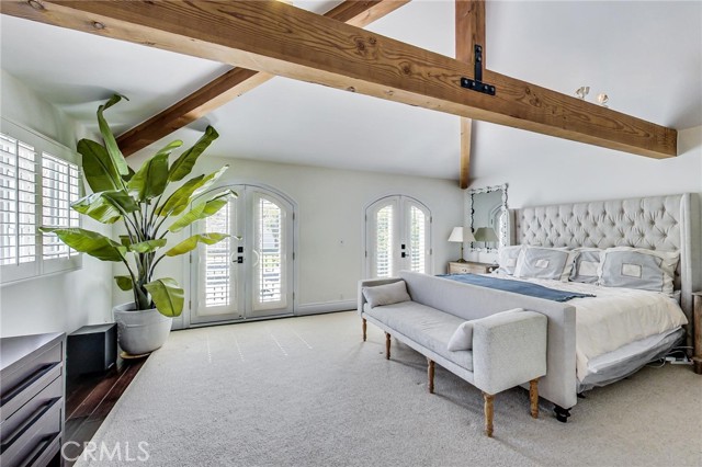 Unique main bedroom (bedroom #5) style features 2 set of French doors with Juliet balconies, vaulted ceilings with exposed massive beams and sunny/bright east/south facing exposures.