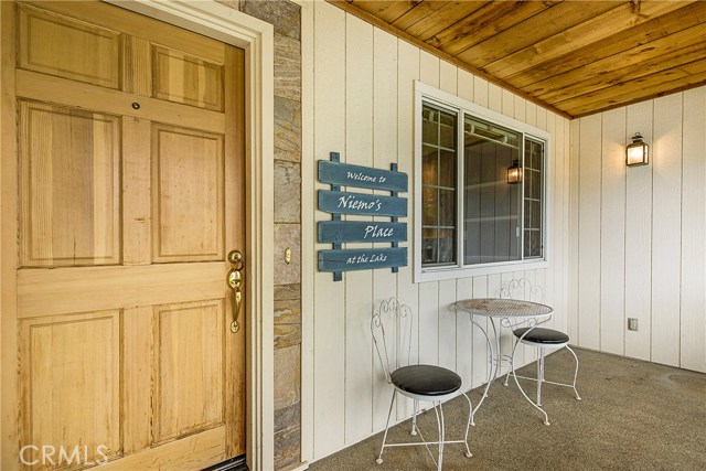 Covered front porch with in-laid wood ceilings