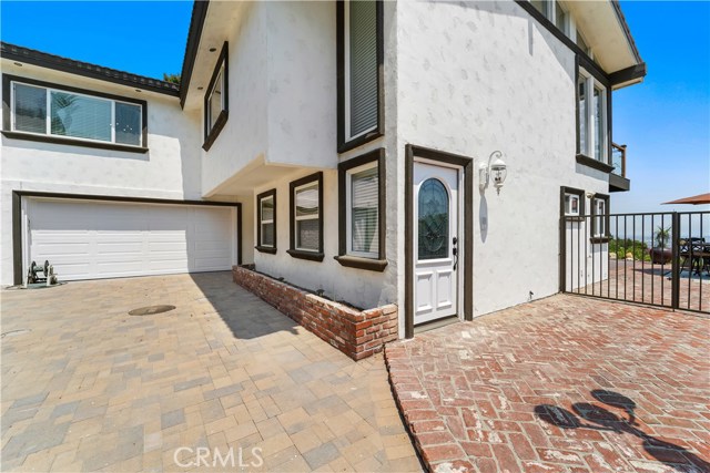Lower level entry door and two car garage.