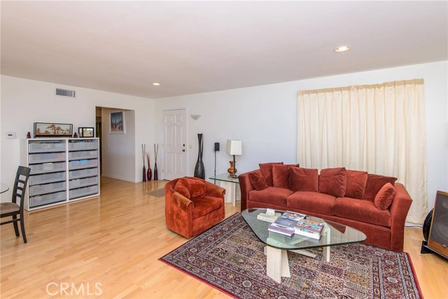 Great room facing entry area and hallway to bedrooms.