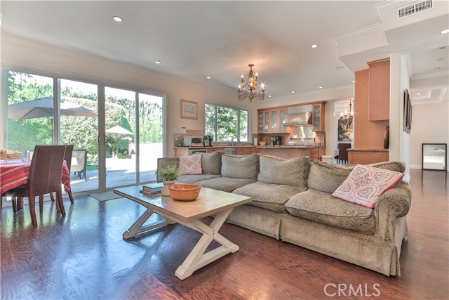 living room opens up to kitchen and backyard