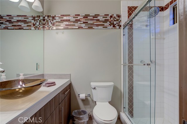 Loft bathroom with nice sized shower.