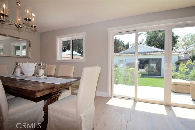 view from great room to large south facing rear yard, sliding door in garage, would make a wonderful playroom, or man cave