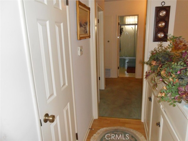 Central Hallway to Bedrooms with quick view of Hallway Full Bathroom. Now take a look to right of picture...Functional Easy Storage Space.