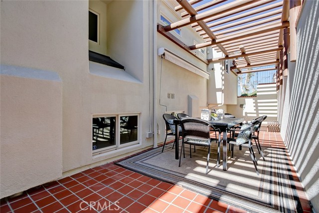 Secluded Patio in rear of home, 2  or 3 steps down into kitchen.