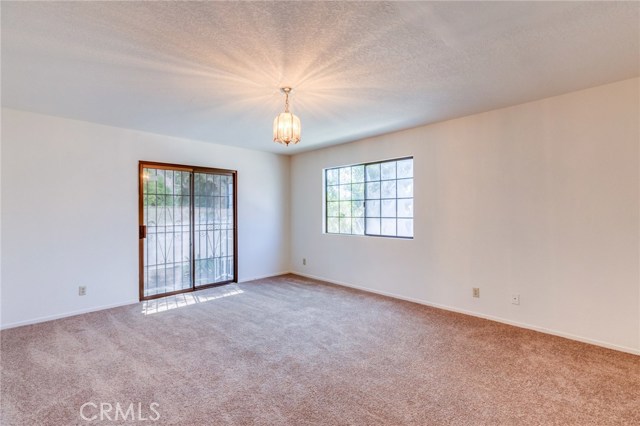 Separate Family Room with access to backyard is multi-functional and has convenient access to the garage.