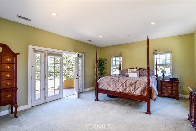 LARGE master bedroom has a walk-in closet and a balcony of its own