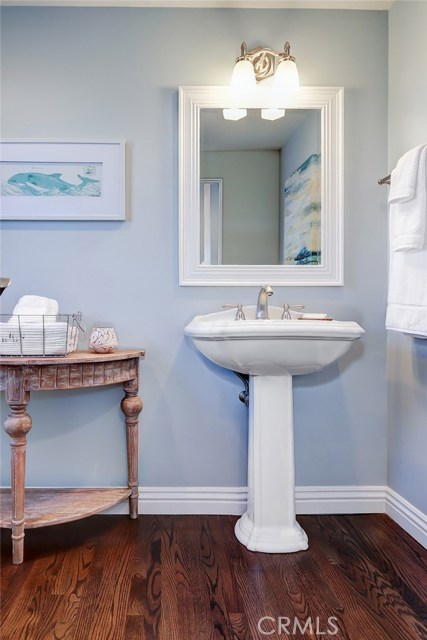 Powder room adjacent to the living room and formal dining area is easy access for guests.