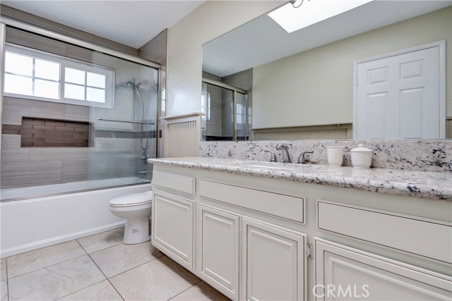 Upstairs is the second bath with access to another bedroom.