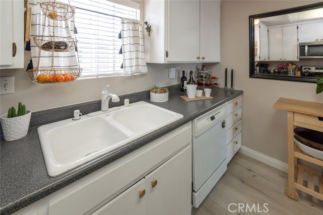 You will find lots of cabinet space and a deep pantry in this efficient kitchen.