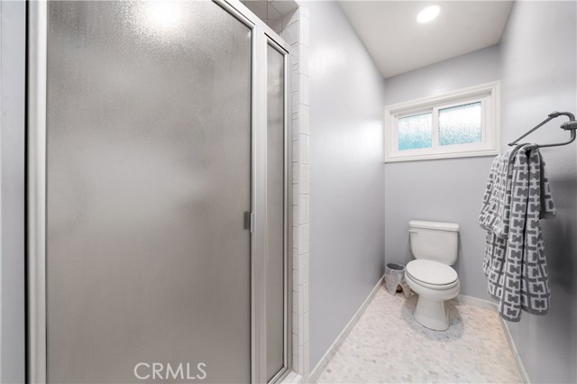 Master bathroom shower and toilet area.