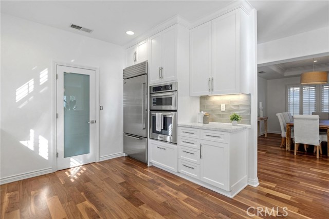 Large, Open Format Kitchen with Marble Counters, Built-in Refrigerator and Stainless Appliances