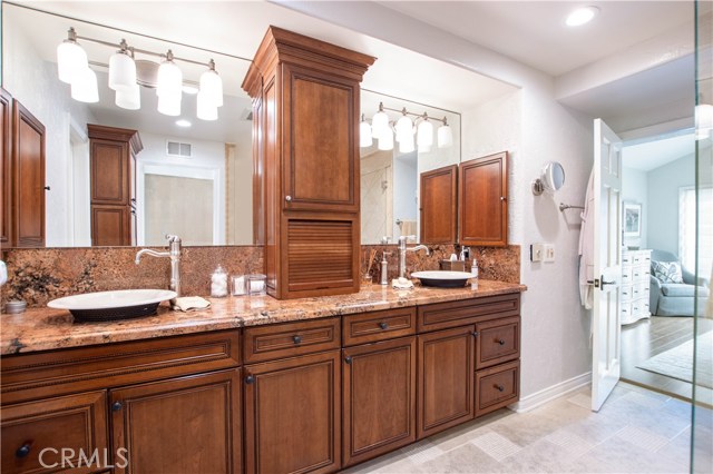 custom Cabinets and granite counters warm this room