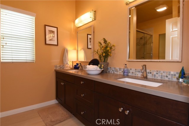 Hall bathroom upstairs is also totally remodeled and has dual sinks, Caesarstone counter,  an new plank tile flooring
