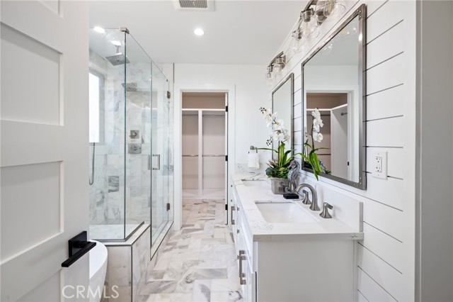 Decadent master bath with expansive walk in closet