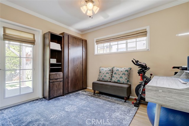 Third bedroom, currently used as an office, opens to the private back yard and features a murphy bed, providing a flexible floorplan for guests!