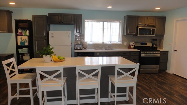 Large center island with Quartz counters great for entertaining or everyday life!